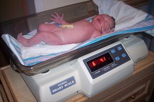 Baby being weighed