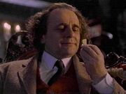 Seventh Doctor holding jelly baby