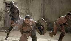 Oenomaus trains spartacus and crixus