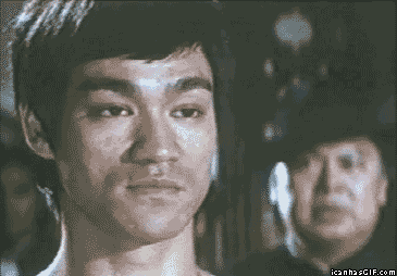 Funny-gif-Bruce-Lee-laughing.gif
